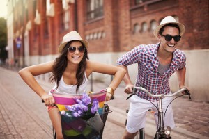 Couple riding bicycles in the city